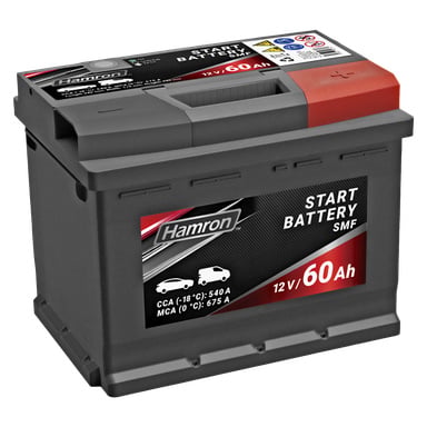 Ett Hamron 12V 60Ah bilbatteri med ett rött och grått lock som visar varumärkesnamn, specifikationer som CCA 540A och MCA 675A, tillsammans med flera ikoner och varningssymboler.