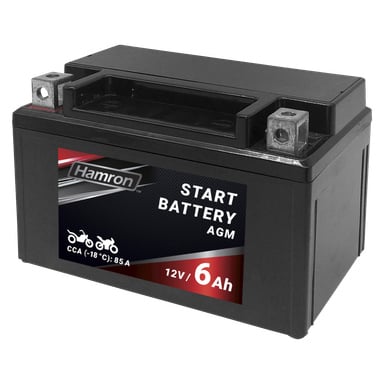 Svart rektangulärt Hamron MC AGM-batteri, 12V 6Ah, med metallterminaler monterade ovanpå. Etiketten visar ikoner för motorcykel och snöskoter och anger ett kallstartsampervärde (CCA -18°C) på 85A.