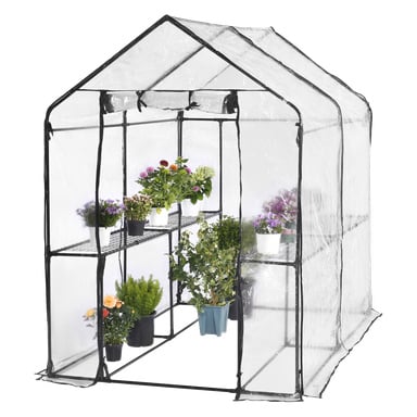 Ett Hard Head Greenhouse med en stadig svart ram och genomskinligt plastskydd, innehållande fyra hyllor fyllda med blommande krukväxter samt bladgrönsaker, med fler växter arrangerade på golvet inuti.