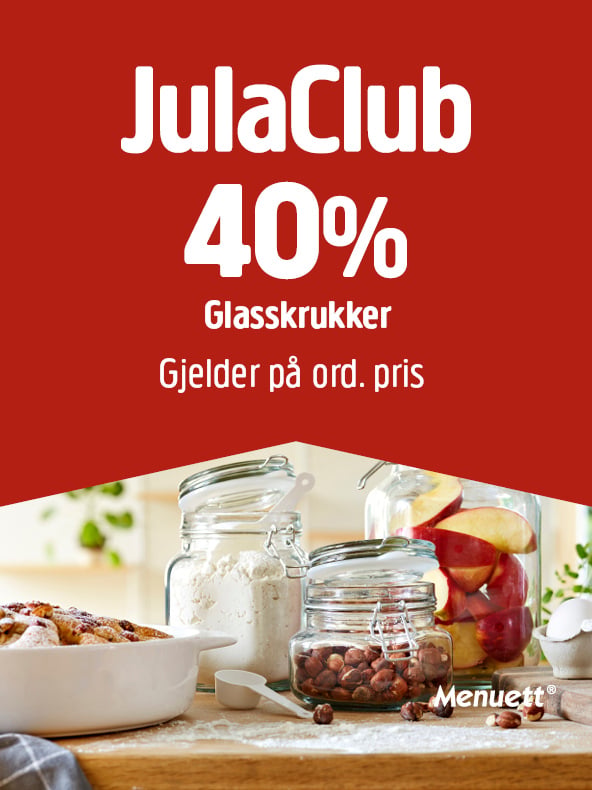 Glasskrukker med mel, hasselnøtter og fruktskiver står på kjøkkenbenken. En reklametekst over bildet fremhever en rabatt på 40 % for JulaClub-medlemmer, og Menuett-logoen vises i nedre høyre hjørne.
